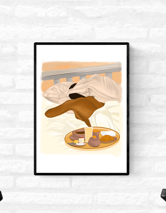 Framed wall art print of a black woman sleeping in bed with her head partially hidden by her pillow and a breakfast tray of food