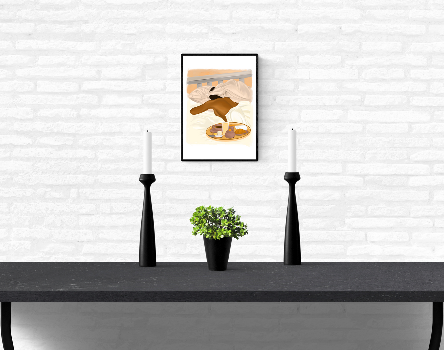 Mounted and framed wall illustration of a black woman sleeping in bed with her head partially hidden by her pillow and a breakfast tray of food on an interior white brick wall