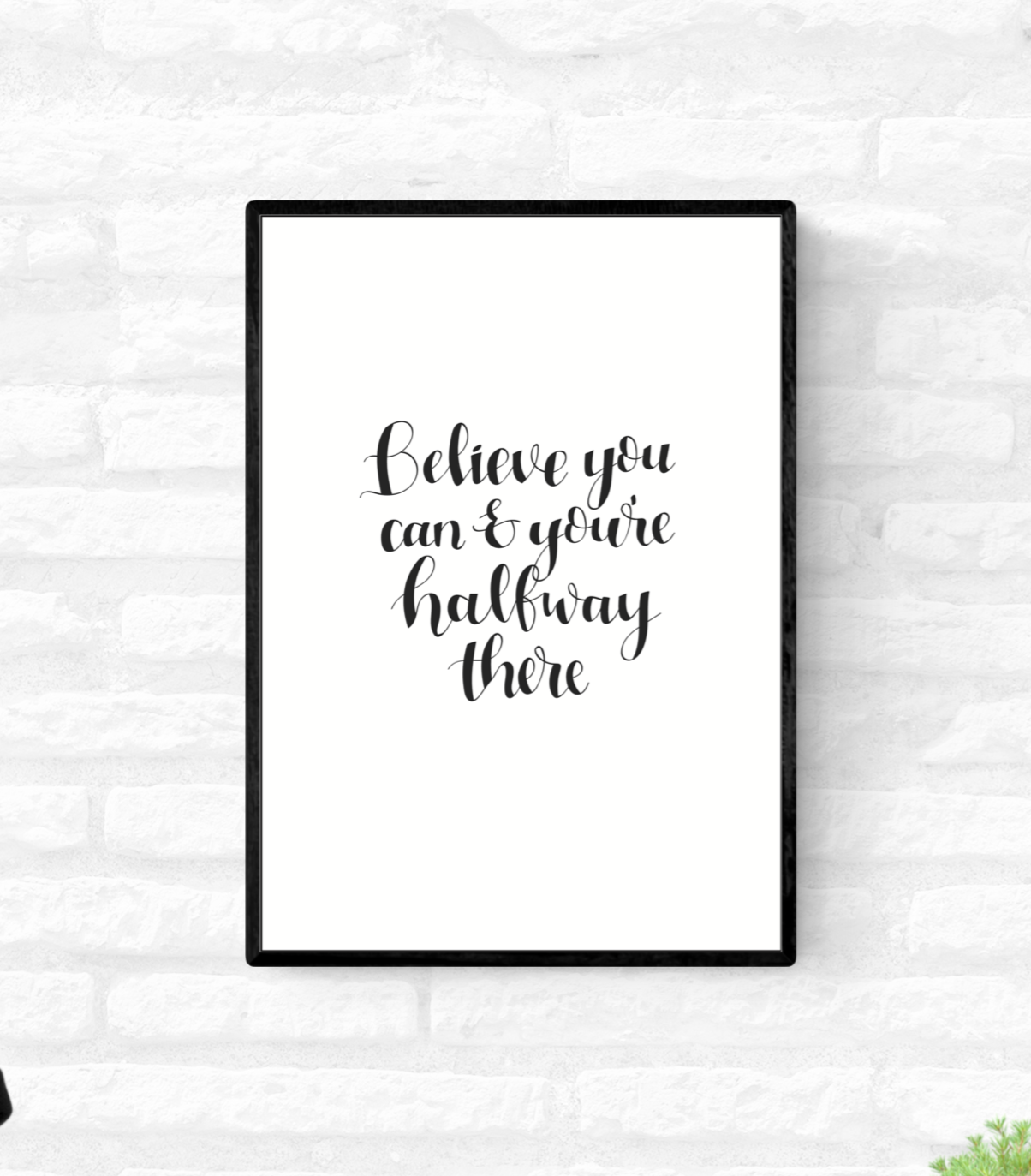 Framed wall quote print with the words “Believe you can and you’re halfway there” in black and white colour