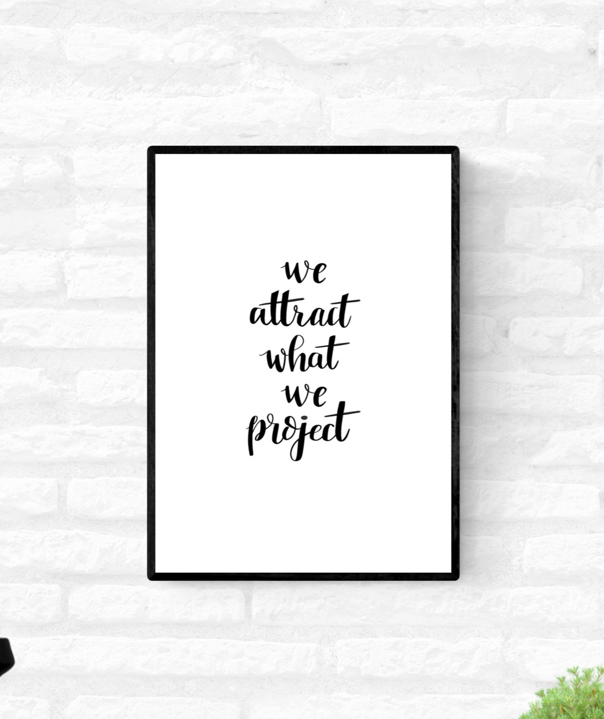 Framed wall quote print with the words, “we attract what we project”