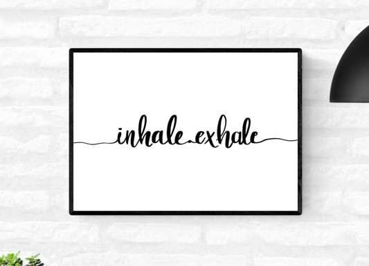 Framed landscape monochrome wall quote print with the words, “inhale exhale” written across it